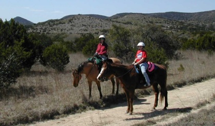 Riding horses in Bandera TX
