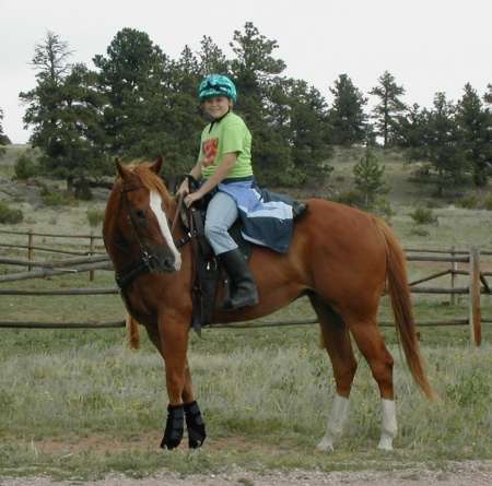 girl riding horse on dude ranch