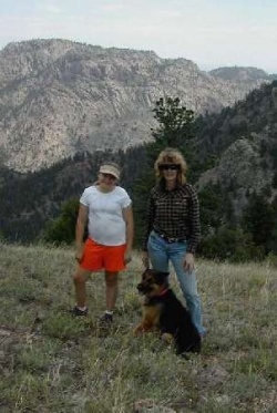 Chris and Kaitlin and Lady hiking in the National Forest