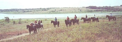 Group trail ride on Texas lake