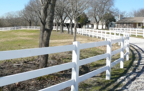 White plastic fence with horses